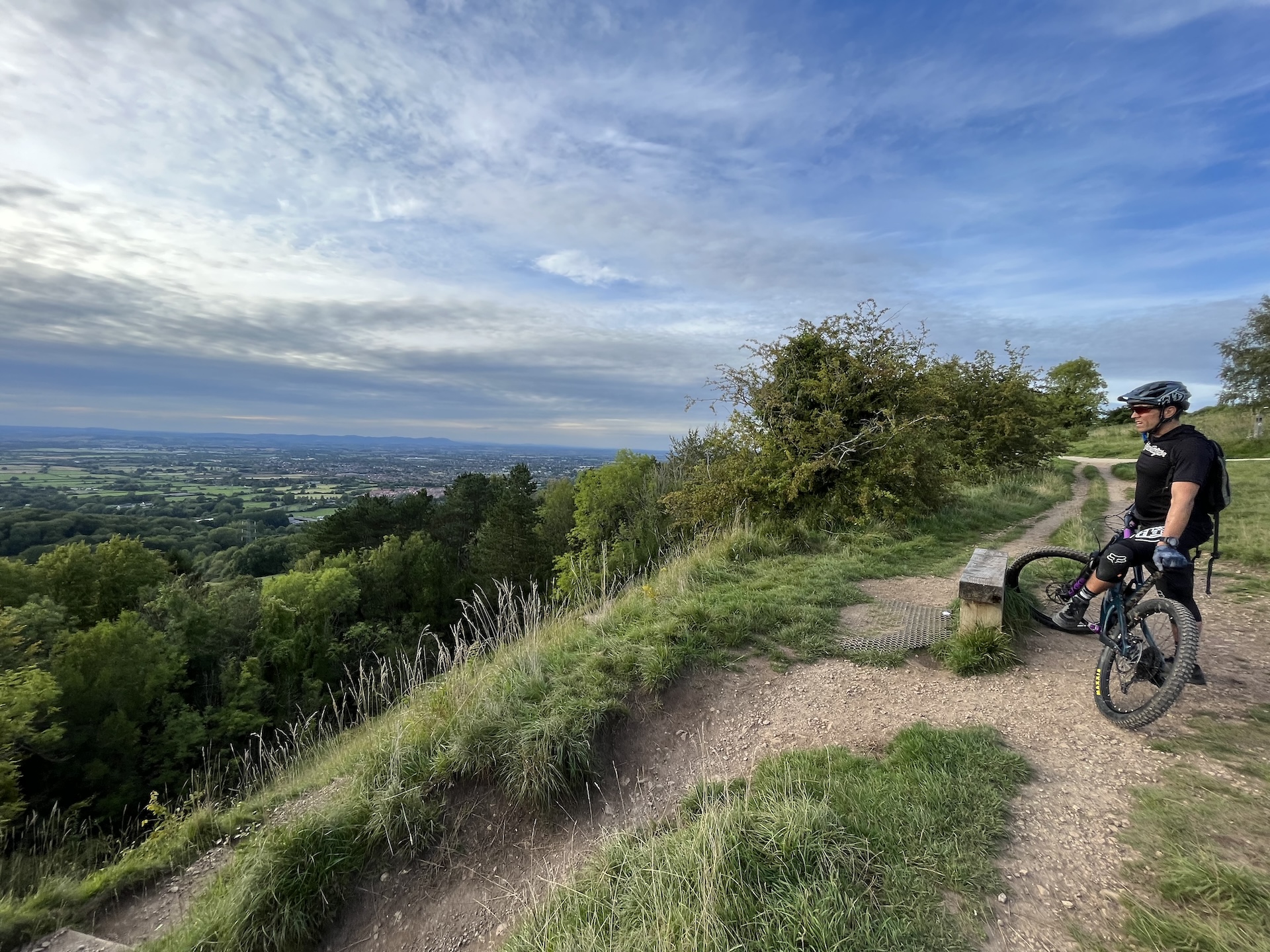 Chris Dowling on his mountain bike looking over Leckhampton Hill