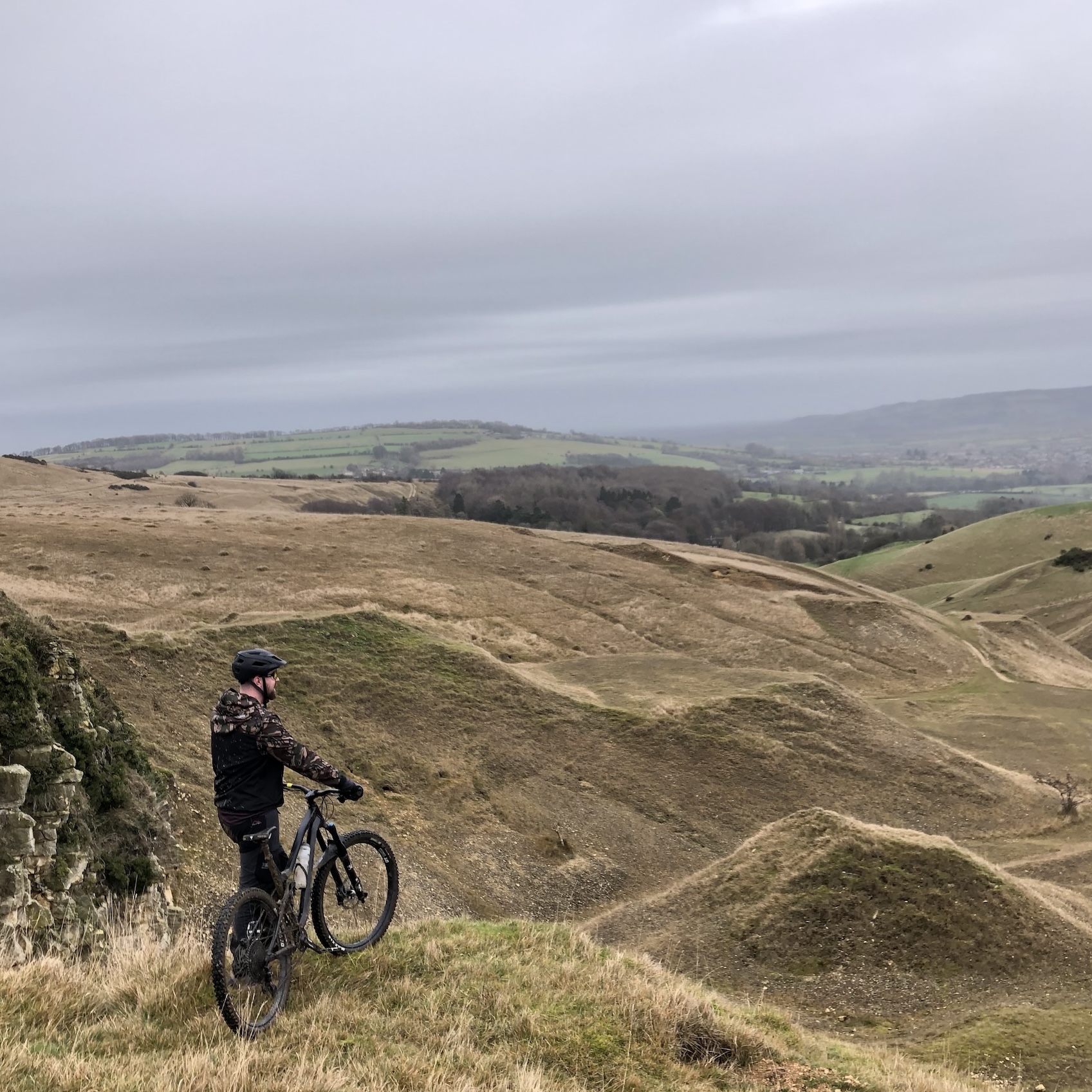 Matt Beard on his mountain bike looking over Cleeve Hill